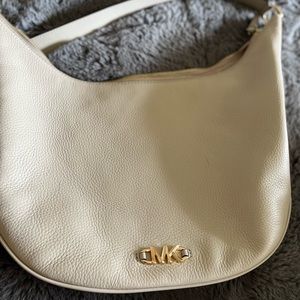 Only worn a couple of times. Basically brand new! Tiny blemish on the front.